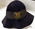 School hat for Brighton School. Navy blue felt hat with navy blue ribbon with school crest and text, 'Fortiter et recte'