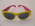 Bright Pink and Orange sunglasses with 'Done' Logo on inside of right arm