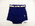 Blue wool skirted style trunks, white trim, white cotton belt with silver buckle through belt loops.