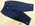 Pedal pushers in blue cotton tabs with buttons down sides front fly with arrowlike facing and two buttons tabs with buttons on pant legs pockets machine sewn S12